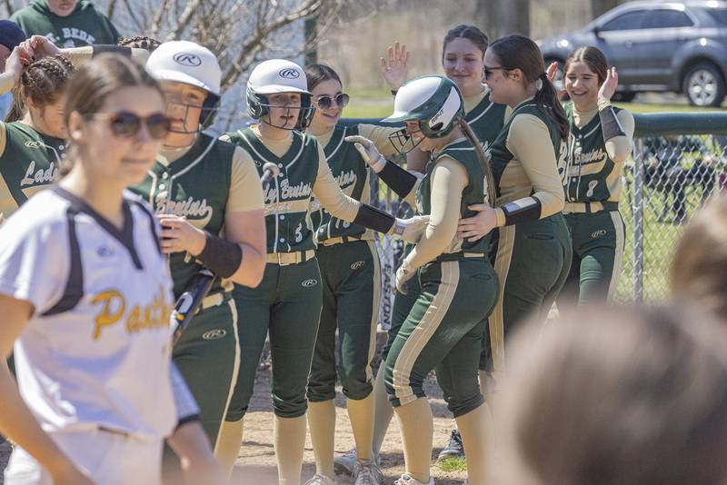 St. Bede players celebrate the game winning RBI against Putnam county during the game on April 8, 2023 at St. Bede Academy.