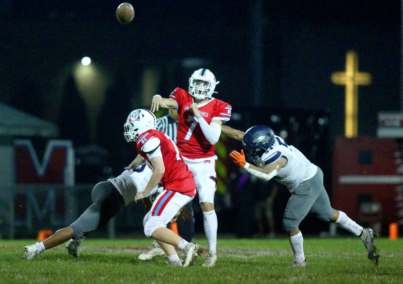 Marian Central’s Cale McThenia makes a toss against Chicago Hope in varsity football at Woodstock Friday night.