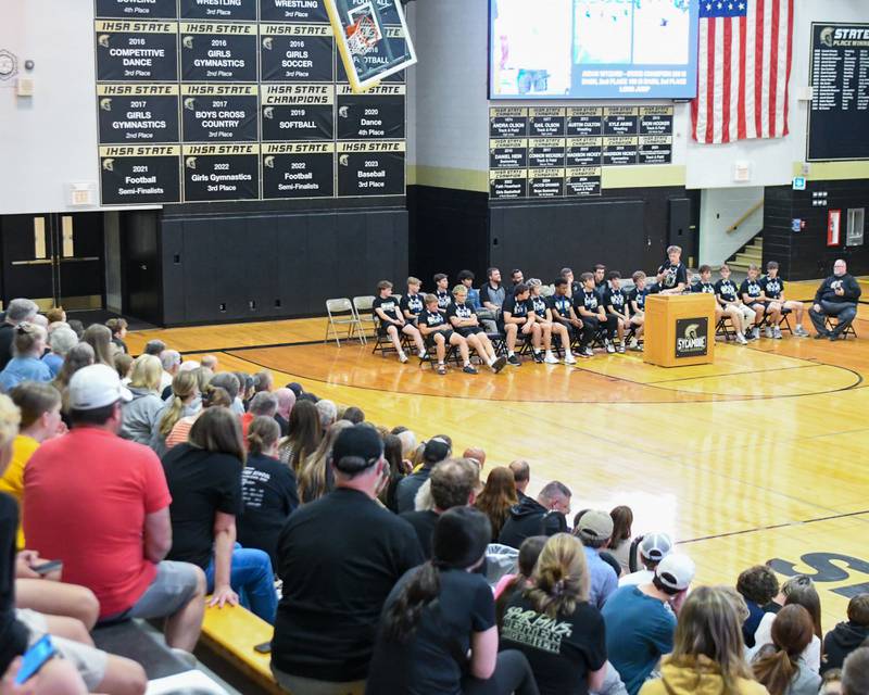 Sycamore’s Aidan Wyzard who placed in the 200-meter dash, 100-meter dash as well as the long jump at the IHSA meet speaks during the pep rally on Tuesday June 4, 2025, at Sycamore High School after the team brought back the championship trophy.