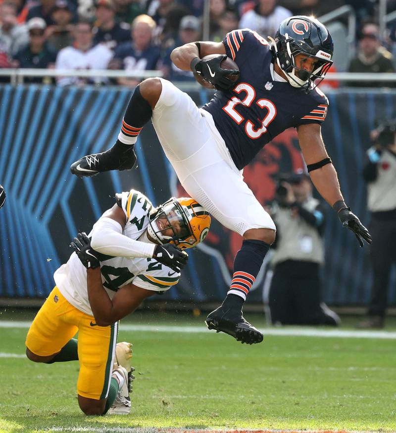 Chicago Bears running back Roschon Johnson tries to hurdle Green Bay Packers cornerback Carrington Valentine Sunday, Nov. 17, 2024, during their game at Soldier Field in Chicago.