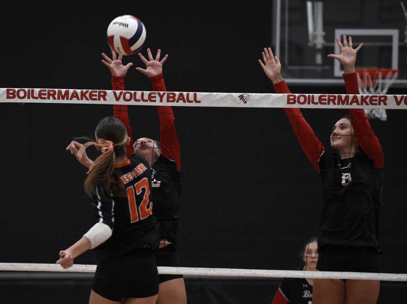 Bradley-Bourbonnais' Harper Tollefson, left, and Hannah Wojnowski, right, defend against a hit from Beecher's Elena Kvasnicka in a match on Tuesday, September 2, 2025.