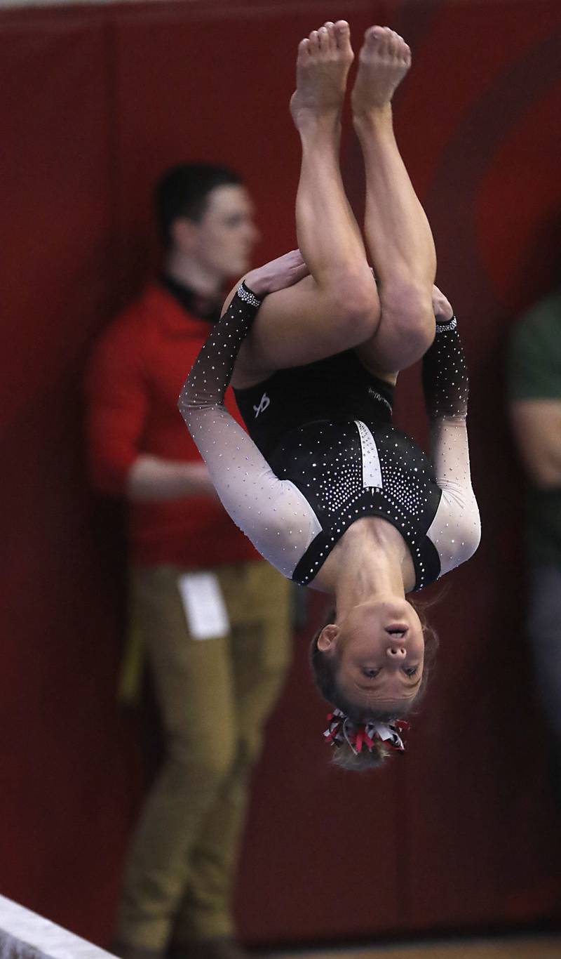 Lincoln-Way East’s Alivia Ozinga competes in the preliminary round of the balance beam Friday, Feb. 17, 2023, during the IHSA Girls State Final Gymnastics Meet at Palatine High School.