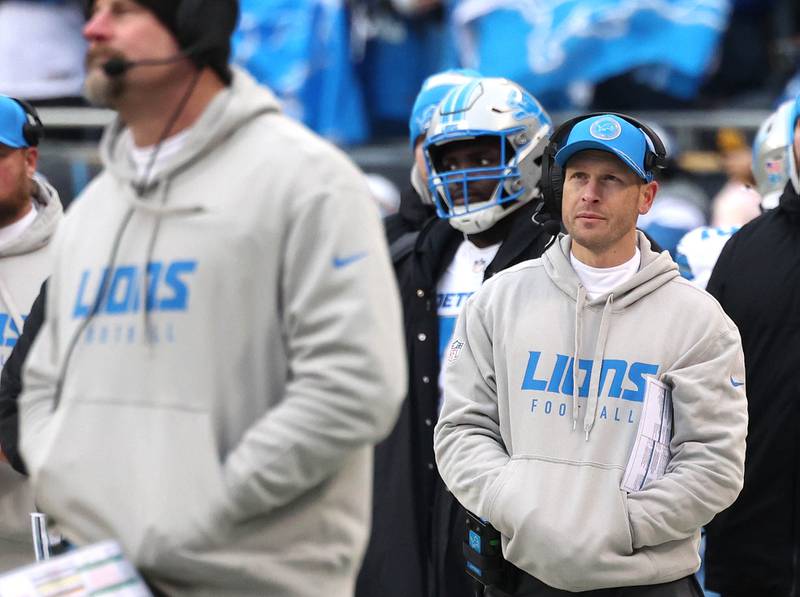 Detroit Lions offensive coordinator Ben Johnson (right) watches a play on the video board behind Lions head coach Dan Campbell during their game against the Chicago Bears Sunday, Dec. 22, 2024, at Soldier Field in Chicago.