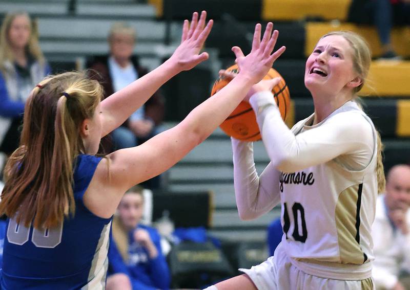 Sycamore's Lexi Carlsen shoots over St. Francis' Lynsey Cleveland during their game Thursday, Jan. 4, 2023, at Sycamore High School.