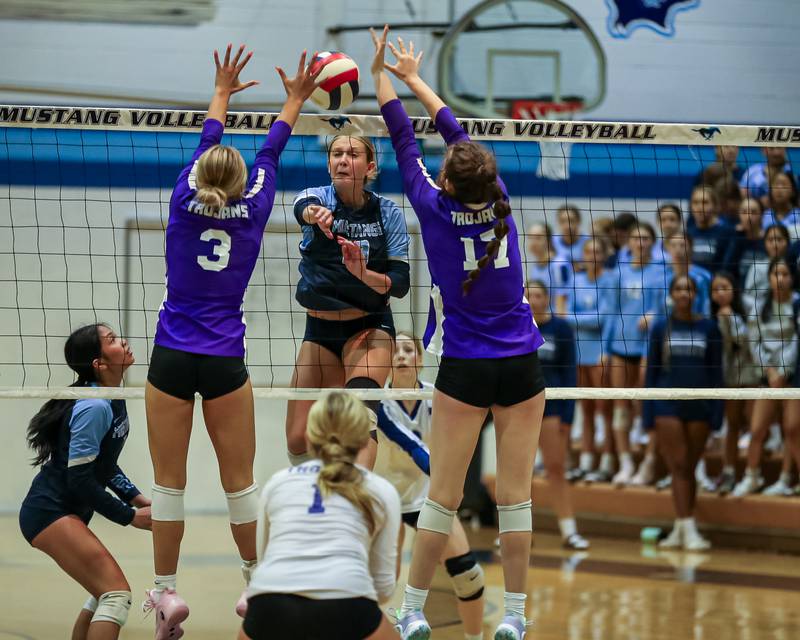 Downers Grove South's Alexis Gagnier (18) spikes the ball during volleyball match between Downers Grove North at Downers Grove South.  Sept 7, 2023.