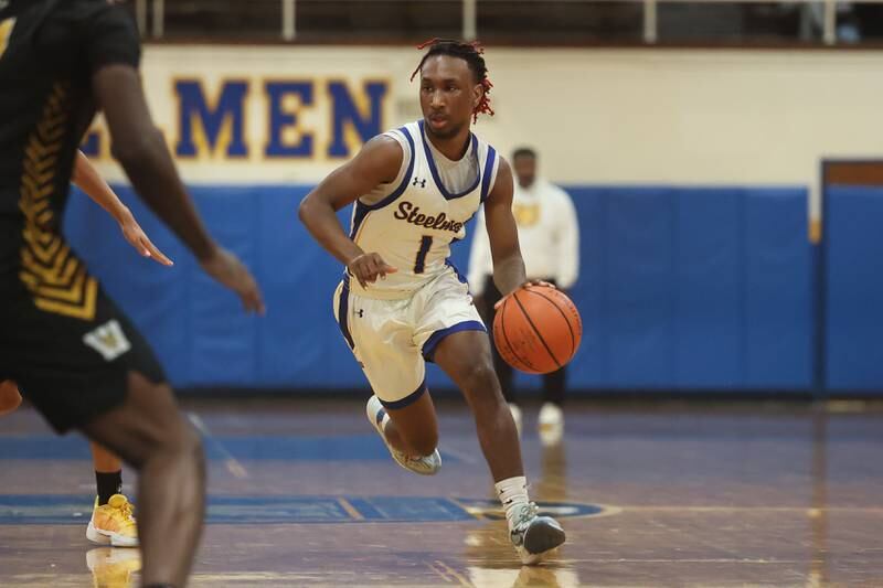 Joliet Central’s Jamarcho Holman works the ball upcourt against Joliet West on Saturday, Jan. 27th, 2024 in Joliet.