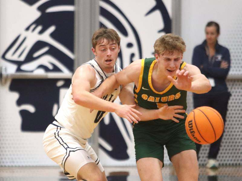 Cary-Grove’s Brandon Freund, left, battles Crystal Lake South’s Carson Trivellini in varsity boys basketball on Wednesday, Dec. 3, 2025, at Cary-Grove High School in Cary.