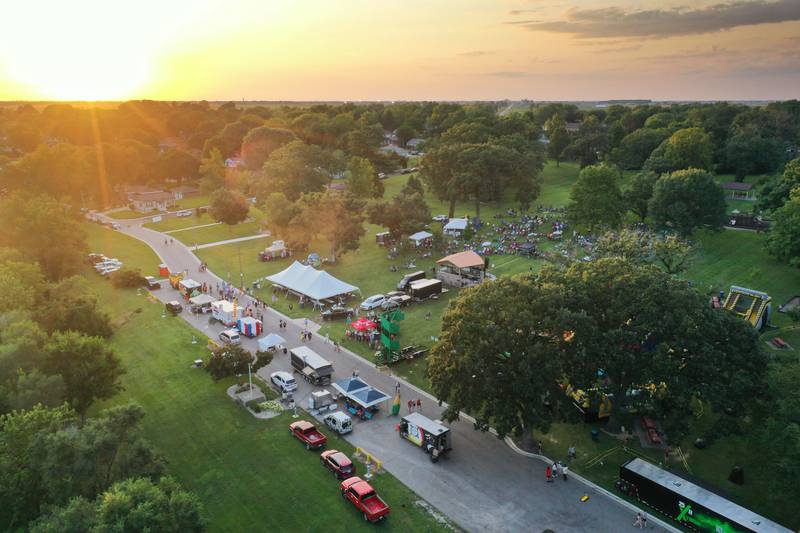 The sun sets over the Taste of the Illinois Valley festival on Saturday, Aug. 3, 2024 at Centennial Park in Peru.