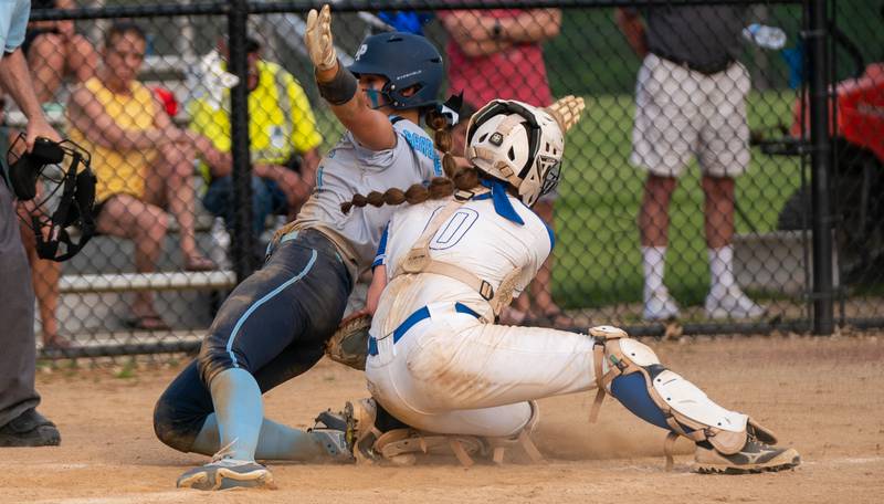 St. Charles North's Sophia Olman (10) tags Lake Park's Michela Barbanente (1) for an out during a softball game at St. Charles North High School on Wednesday, May 11, 2022.