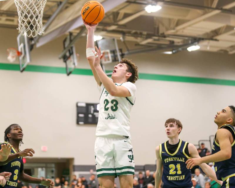 Bishop Mcnamara's Karter Krutsinger (23) puts in a late basket during their Class 2A Seneca Sectional final basketball game between Bishop McNamara at Yorkville Christian, March 6, 2026 in Senaca.