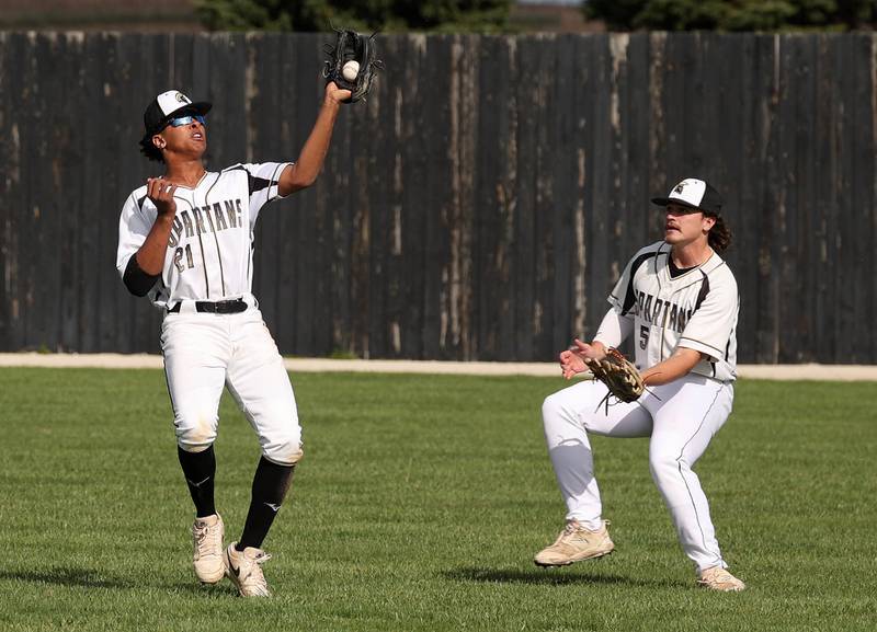 Sycamore's Tyler Townsend makes a catch in front of Sycamore's Tyler Lojko Wednesday, April 23, 2025, during their game against La Salle-Peru at the Sycamore Community Sports Complex.