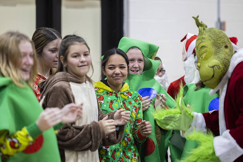 The Grinch rallies his troops Saturday, Nov. 19, 2022 during the Rock Falls Chamber’s Grinch Dodgeball event as part of the town’s Hometown Holidays. Grinch’s team consisted of students from Rock Falls Middle School’s student council vs kids of all ages.