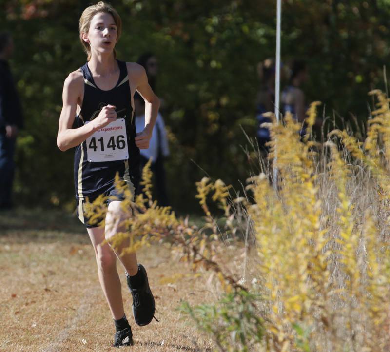 Marquette's Joe Amicon runs in the Class 1A Regional Cross Country boys race on Saturday, Oct. 22, 2022 at the Seneca FFA Farm in Marseilles.