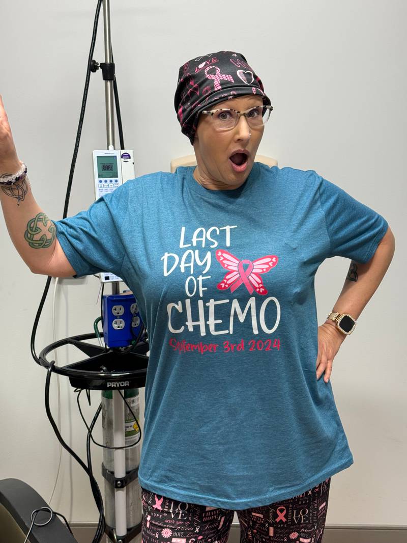 Shannon Connolly poses for a photo on her last day of chemo therapy at Silver Cross Hospital in New Lenox.