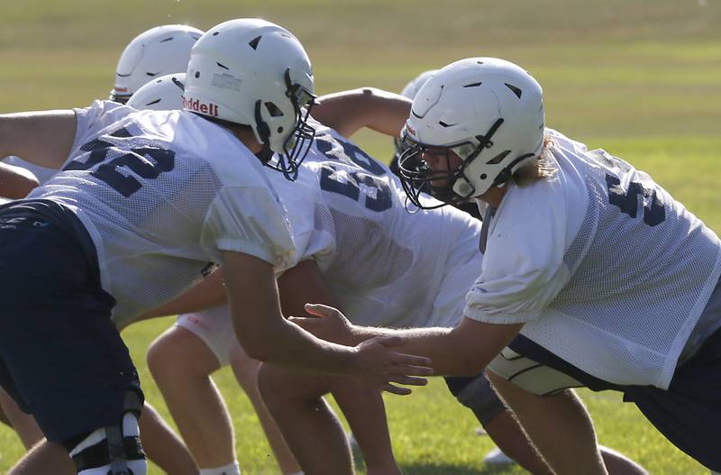 Cary-Grove's Jack Hissong blocks during Cary-Grove’s first football practice of the upcoming season on Monday, August 11, 2025, at Cary-Grove High School.