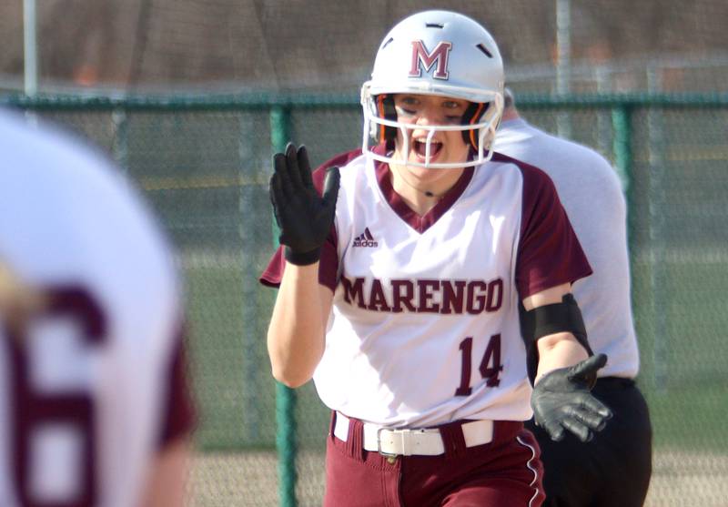 Marengo’s Kylee Jensen arrives home on a home run against Richmond-Burton in varsity softball at Marengo Tuesday.