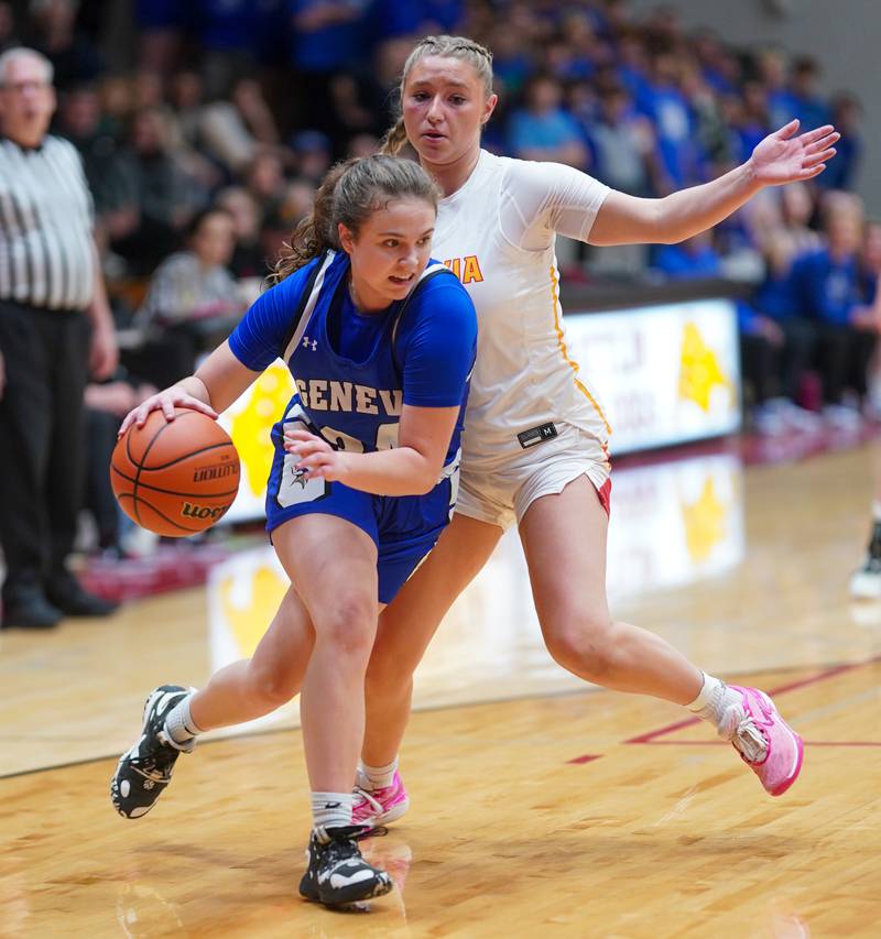 Geneva’s Kinsey Gracey (24) drives the baseline against Batavia’s Kylee Gehrt (21) during a basketball game at Batavia High School on Friday, Jan 26, 2024.