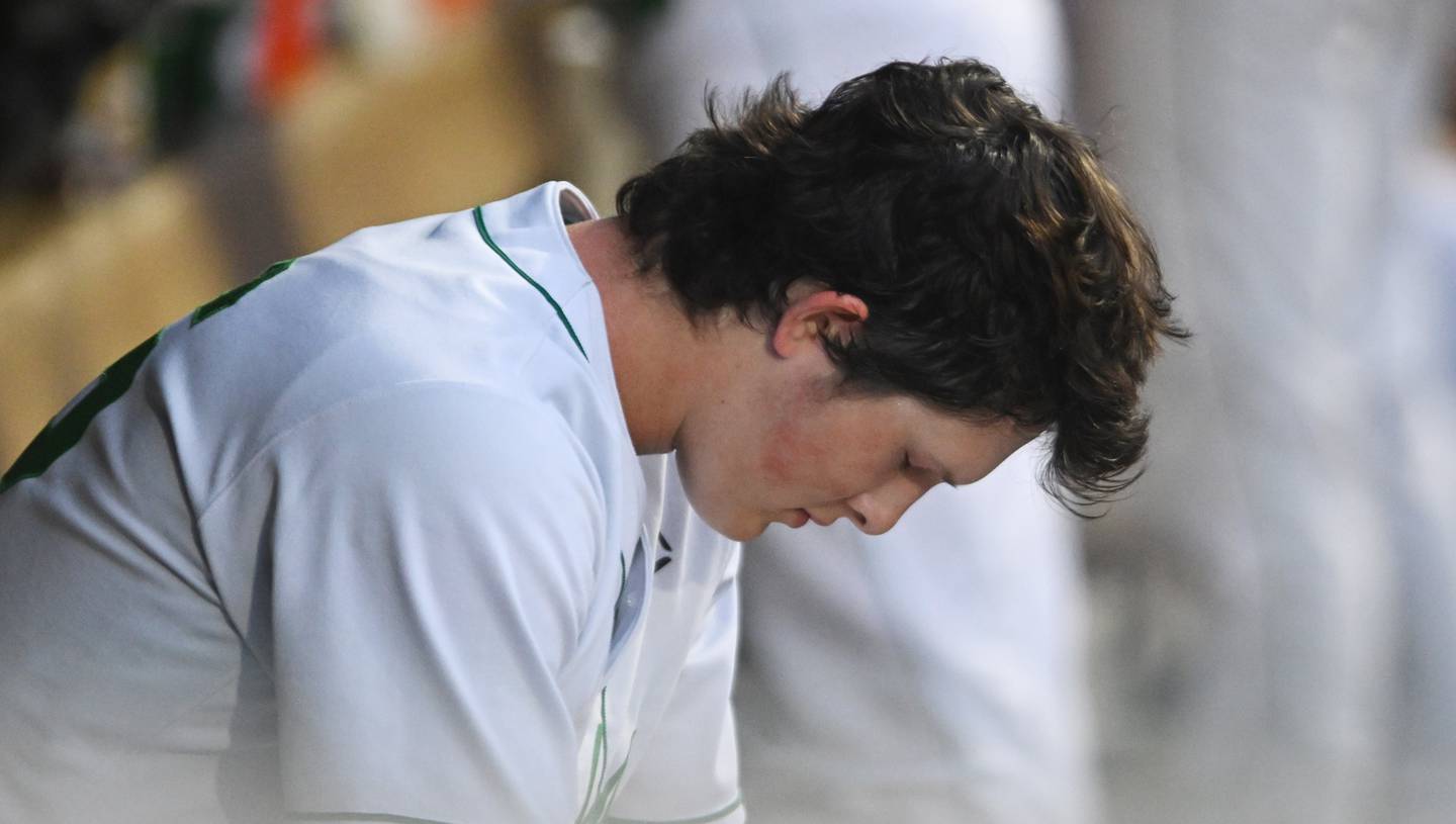 York pitcher Ryan Sloan pauses between innings in the dugout after giving the game's sole run in the DukesÕ 1-0 loss to Conant during the Class 4A state baseball semifinal at Duly Health and Care Field on Friday, June 7, 2024 in Joliet.