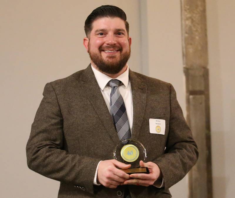 Bill Zens, Executive Director, Illinois Valley Area Chamber Of Commerce poses with his award during  the Illinois Valley Chamber of Commerce 40 Under Forty Awards Gala on Thursday, Feb. 9, 2023 at Westclox in Peru.