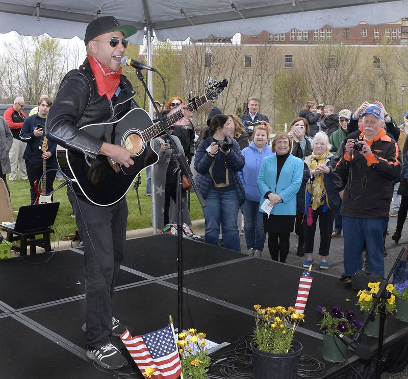 Rage Against the Machine’s Tom Morello, performing his solo project as The Nightwatchman, sings to the crowd assembled for the ceremony Thursday, April 28, 2022, dedicating a plaque to honor Steve Sutton who was shot and killed during a 1932 labor rally in Marseilles.