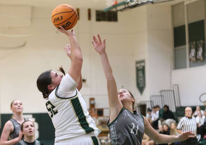 St. Bede's Ava Balestri gets a shot off over Midland's Adalynn Stickel on Thursday, Dec. 4, 2025 at St. Bede Academy.