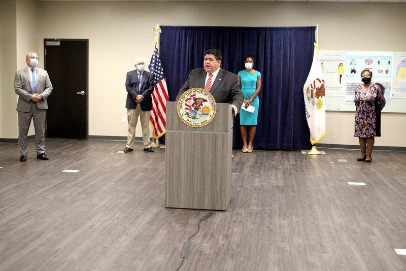 Gov. JB Pritzker addresses the media regarding the increased number of Covid-19 cases in Will and Kankakee counties and new restrictions on those areas during a press conference at the Will County Health Department in Joliet on Aug. 25.