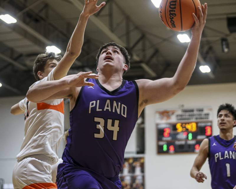 Plano's Kevin Martinez (34) puts in a layup during their basketball game between Sandwich at Plano Tuesday, Jan 27, 2026 in Sandwich.