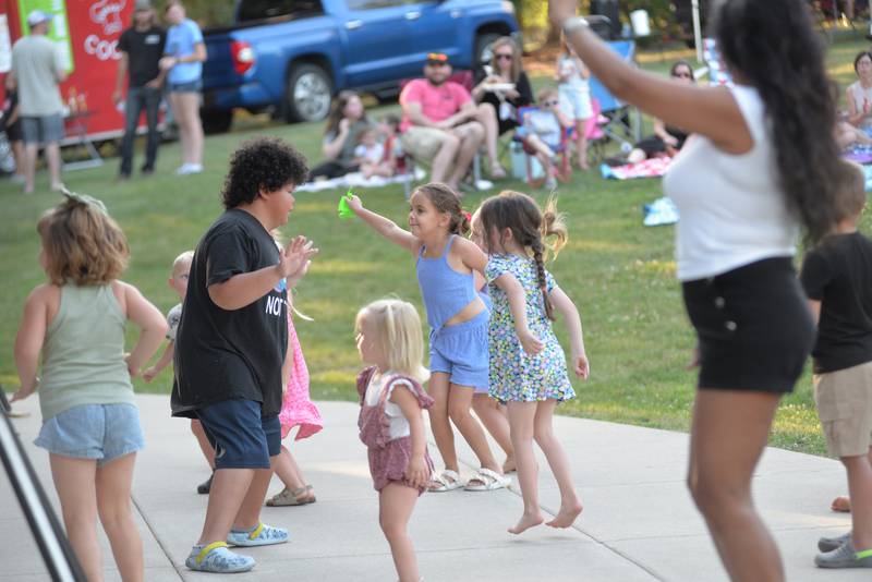 Kids dance to the music of The 80s Hit List band at the Oregon Park District's Concert in the Park on Tuesday, July 1, 2025 at Oregon Park West.