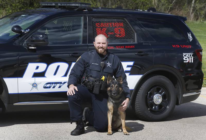 McHenry Police Officer Josh Conway with his K-9 partner, Eli, on Tuesday, April 23, 2024.