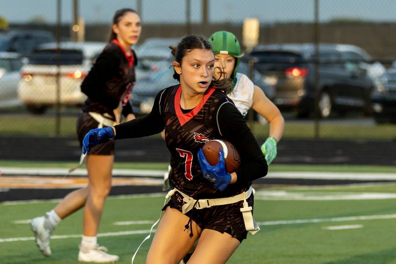 Yorkville's Teaghan Green picks-up yardage during the IHSA Danville Sectional varsity flag football game against Plainfield Central at Plainfield East on Oct. 13, 2025.