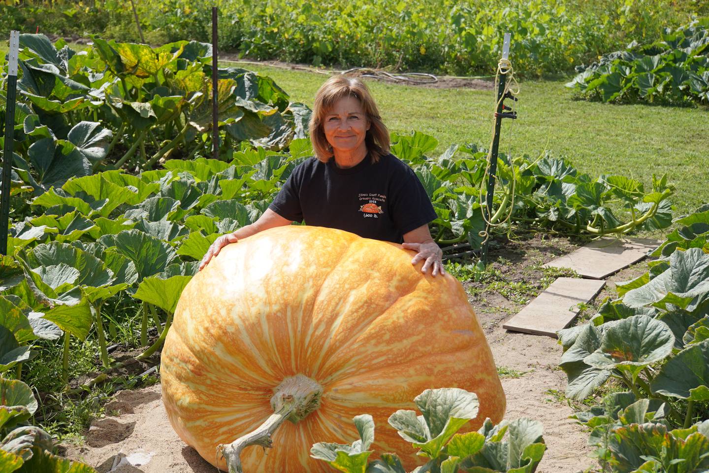 Stillman Valley's Theresa Miller and one of her giant pumpkins, Dimples.
