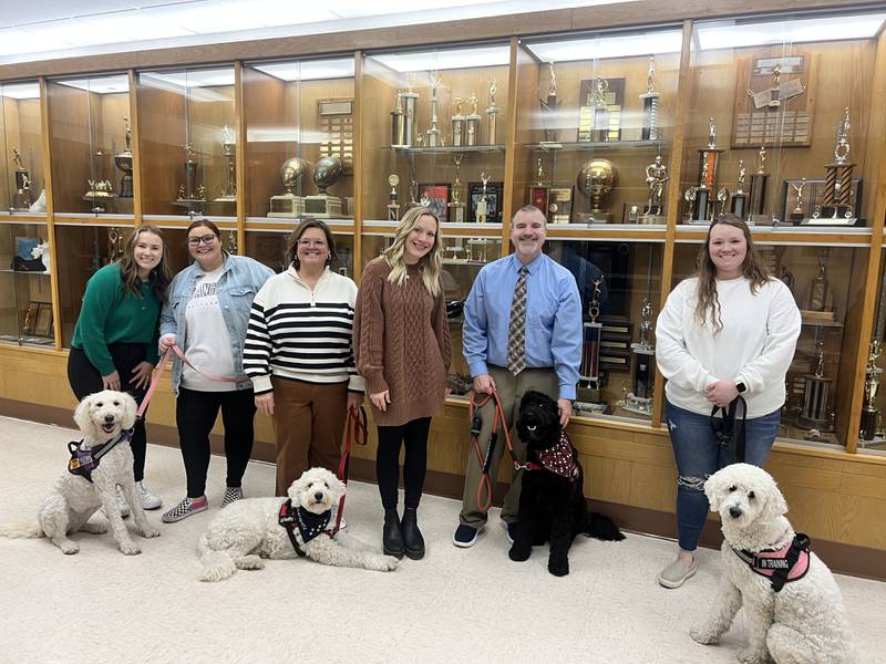 The dogs and their handlers include (from left) Lincoln Elementary School-Lincoln (co-handlers: Jaymee Barbardo, Callie Fusch), Central Intermediate School-Poppy (handler: Heidi Quick), Jefferson Elementary School-Murphy (co-handlers: Alecia Ruiz, Nate Pinter), and Marseilles Elementary School-Sunni (handler: Ali Clark).