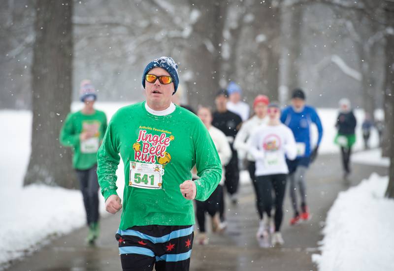 Josh Houberg, of Buckingham, runs along the river at Kankakee Community College for the 35th annual Jingle Bell Run on Sunday, December 7, 2025.