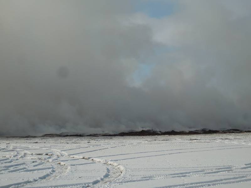 Piles of mulch that caught fire Friday were still smoldering three days later.