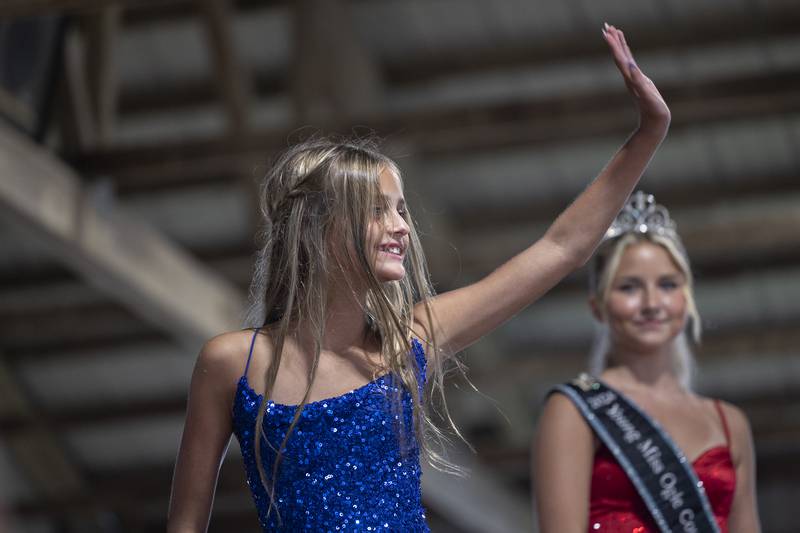 Aniyah Mac Master, 11, waves from the stage in the Ogle County Young Miss pageant Thursday, July 30, 2025, at the Ogle County Fairgrounds.