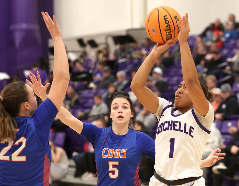 Rochelle's Carmela Bright shoots over Genoa-Kingston's Regan Creadon during their game Monday, Dec. 15, 2025, at Rochelle High School.