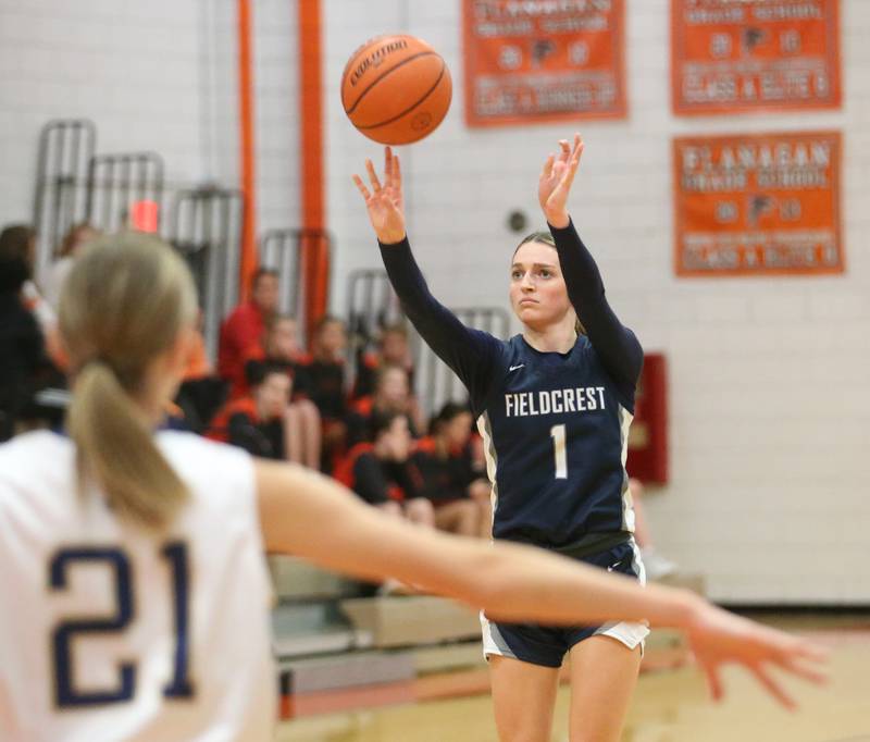 Fieldrest's Kaitlyn White sinks a three-point basket over Marquette's Avery Durdan during the Integrated Seed Lady falcon Basketball Classic tournament on Monday, Nov. 13, 2023 at Flanagan High School.