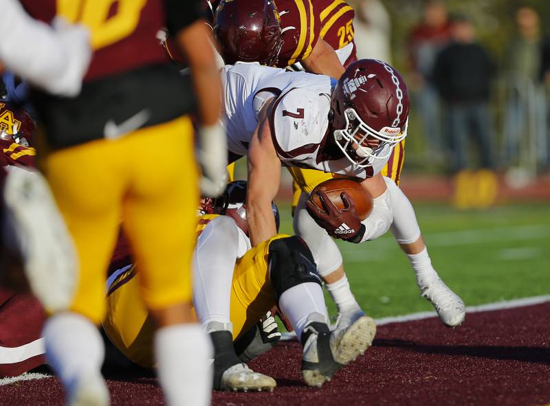 Lockport's Ty Schultz breaks the plane of the goal line for a touchdown during the IHSA Class 8A varsity football semifinal playoff game between Lockport Township and Loyola Academy on Saturday, November 20, 2021 in Wilmette.