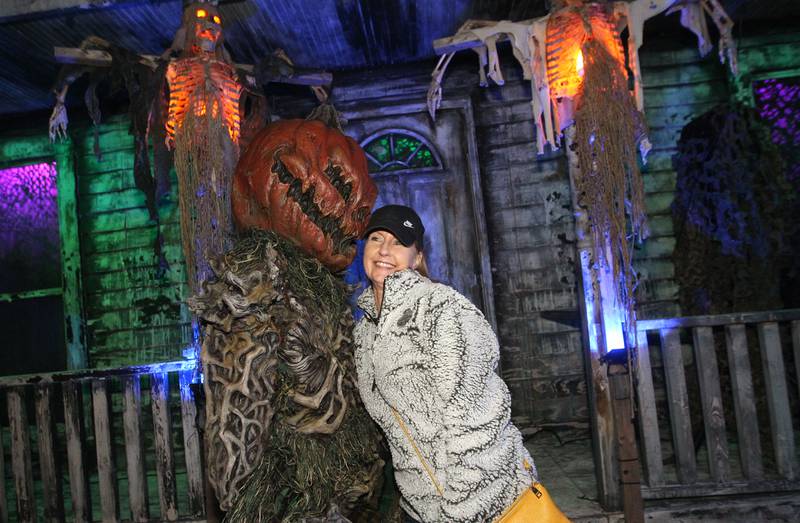 James Johnston, of Vernon Hills (Pumpkin Mickey) takes a photo with Kim Ashbargh, of Woodstock at the Realm of Terror Haunted House in Round Lake Beach.