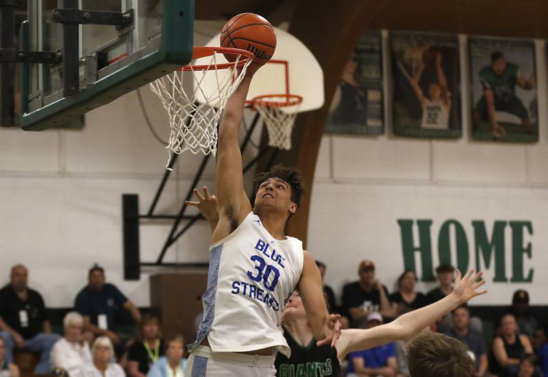 Woodstock's Spencer Cullum dunks the ball during the boy’s game of McHenry County Area All-Star Basketball Extravaganza on Sunday, April 14, 2024, at Alden-Hebron’s Tigard Gymnasium in Hebron.