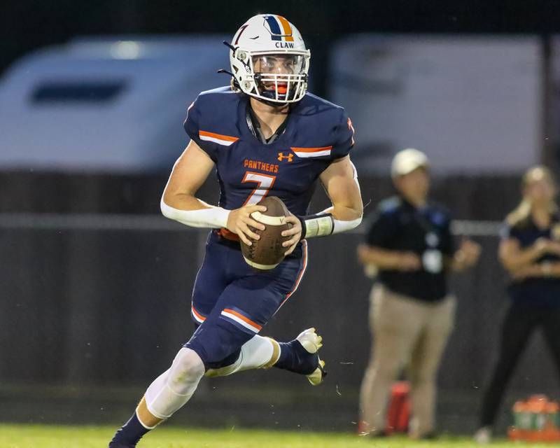 Oswego's Brett Connolly (7) looks for an open receiver during a football game between Neuqua Valley and Oswego on Friday, Aug. 30, 2024 in Oswego. Gary E Duncan Sr for Shaw Local News Network.