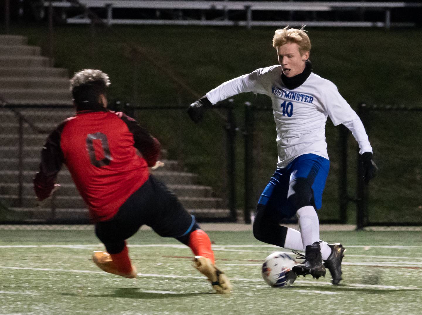 Westminster Christian's Nathaniel Siers (10) plays the ball against Genoa-Kingston's Aaron Acosta (0) during a Wheaton Academy 1A sectional semifinal match at Wheaton Academy on Tuesday, Oct 18, 2022.