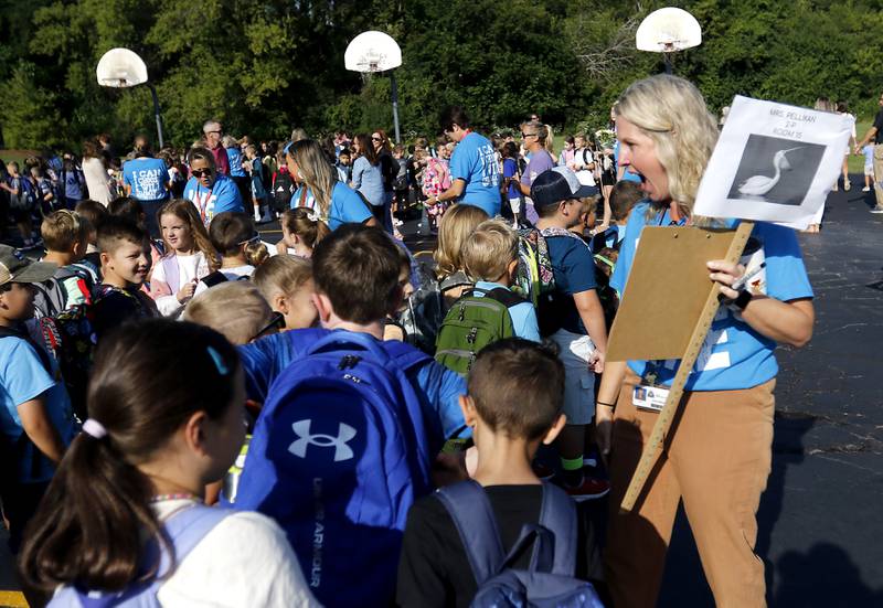 Teacher Jodi Pellikan greets students on the first day of school at West Elementary School in Crystal Lake on Wednesday, Aug. 16, 2023.