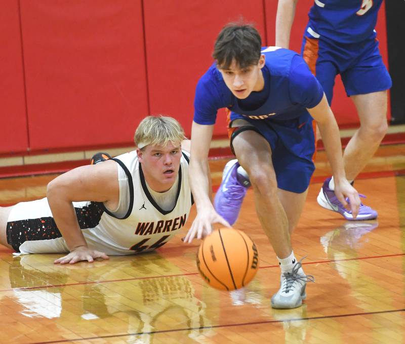 Genoa-Kingston's Benjamin Kleba (11) heads up court after stealing the ball from Warren's Bryce Long (44) on Saturday, Dec. 13, 2025 at the 64th Annual Forreston Holiday Basketball Tournament held at Forreston High School.