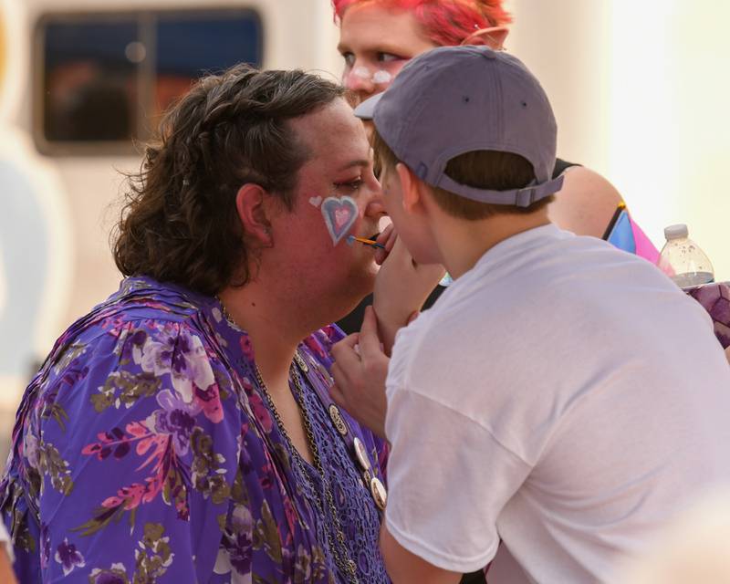 Elizabeth Jensen of DeKalb gets her face painted during DeKalb Pride Fest held outside the Egyptian Theatre, 135 N. Second St. in Van Buer Plaza in downtown DeKalb held on Thursday, June 22, 2023.