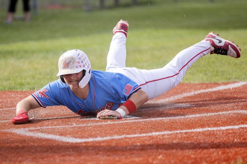 Oregon’s Kade Girton scores the first run of the night against Rock Falls in the Stillman Valley Class 2A Regional semifinal Thursday, May 22, 2025.