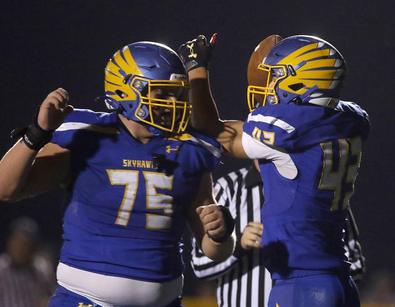 Johnsburg's Braden Olson, right, celebrators a his touchdown with his teammate, Jacob Welch, during a IHSA Class 4A second round playoff football game Friday, Nov. 4, 2022, between Johnsburg and Rochelle at Johnsburg High School in Johnsburg.