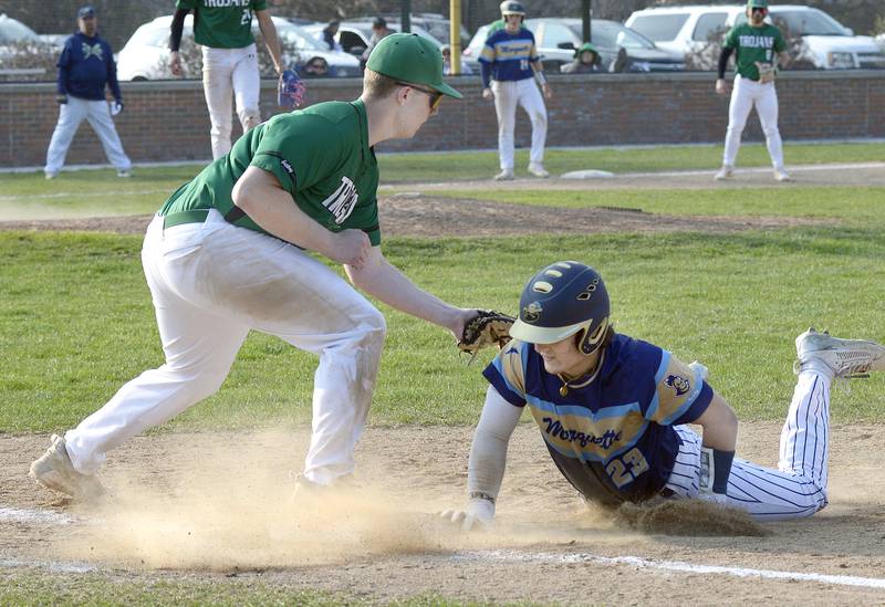 Marquette’s Grant Dose gets under the tag from Dwight’s Wyatt Statler on a pickoff attempt Thursday at Masinelli Field in Ottawa.