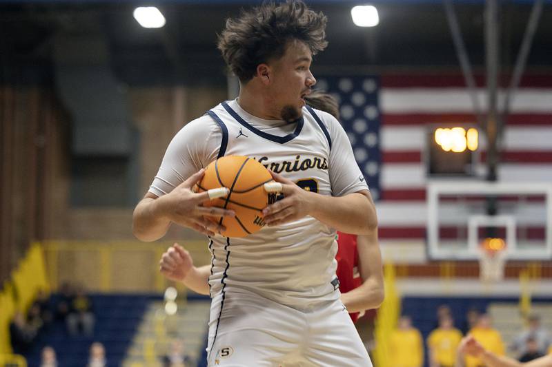 Sterling’s Maddux Osborn hauls in a rebound against Lasalle-Peru Tuesday, Jan. 7, 2025, at Sterling High School.