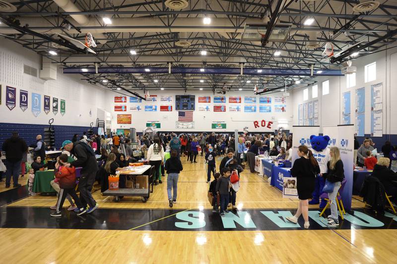 Hundreds of people pack the gymnasium at Troy Middle School in Plainfield for the Will County Executive 2024 Kids’ Fair on Monday, Feb. 19, 2024.